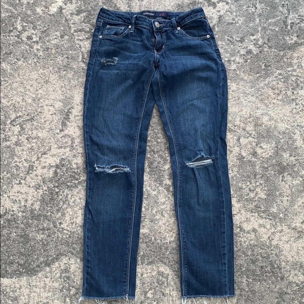 Jeans with holes and cutoff bottoms
